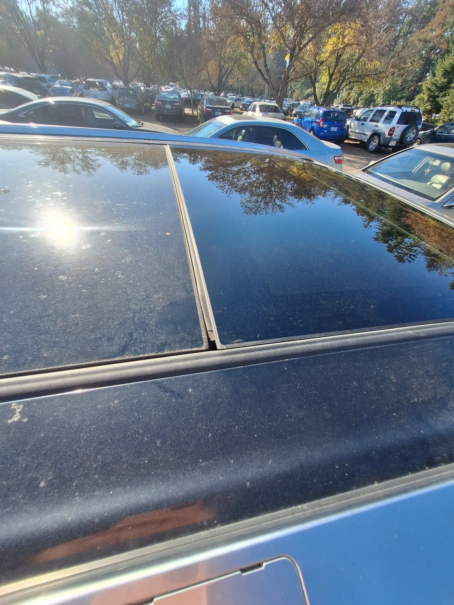 Ford Transit fleet vehicles getting windshield service at commercial lot