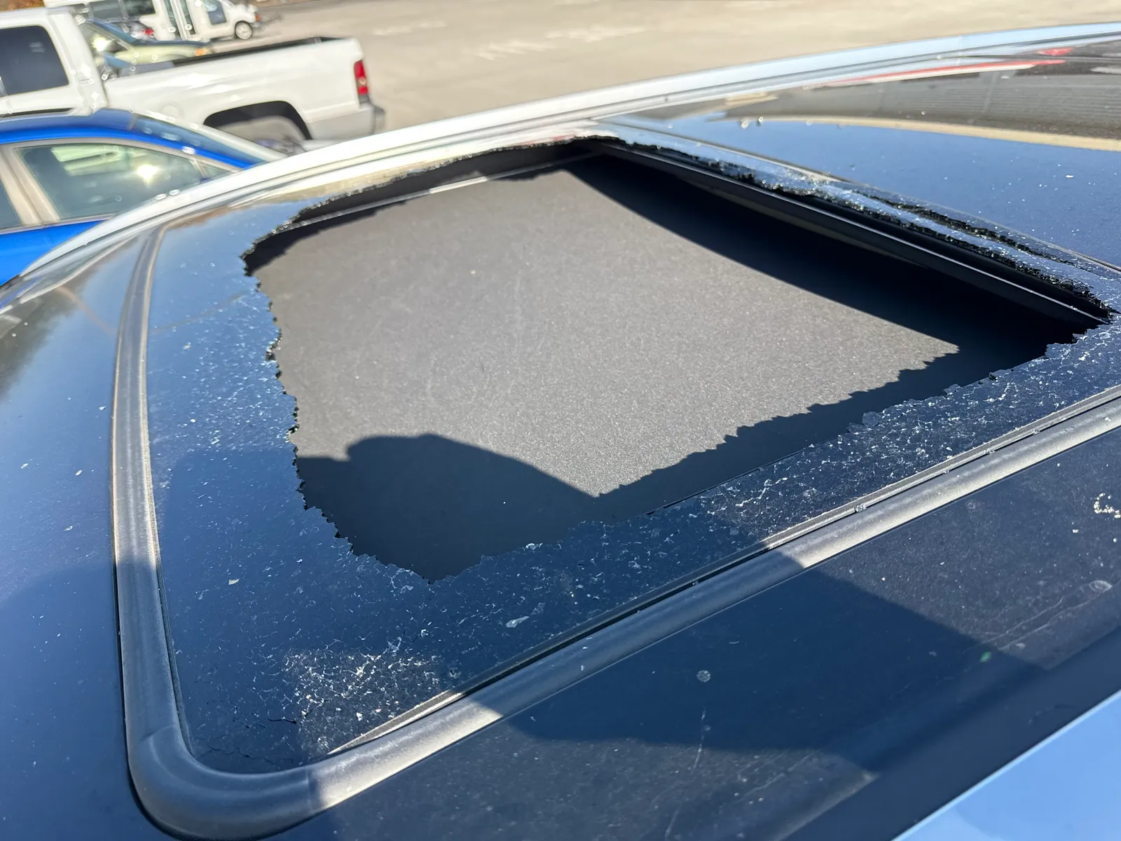 Shattered sunroof glass requiring replacement