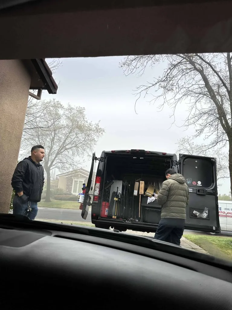 Very Smooth Auto Glass technicians at the service van on a job site